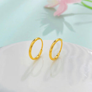 Luxurious 24K Gold Minimalist Wave Hoop Earrings for Elegant Women.
