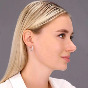 14K White Gold Diamond Half Eternity Huggie Hoop Earrings - 0.57 Carat Total Weight.