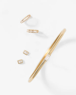 Stunning Baguette Channel-Set Huggie Earrings.