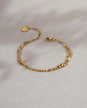 Elegant Waterproof Gold Stainless Steel Layered Bracelet - Dainty Stackable Design for Women.
