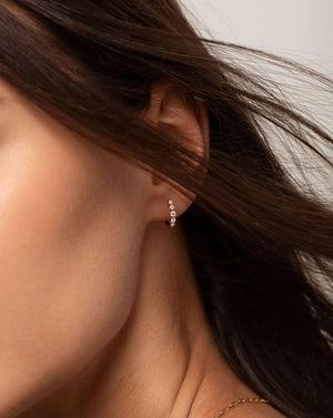 Stunning Graduated Diamond Huggie Earrings for Effortless Elegance.