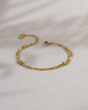 Elegant Waterproof Gold Stainless Steel Layered Bracelet - Dainty Stackable Design for Women.