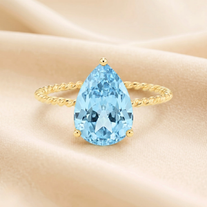 Stunning 14K Yellow Gold Pear-Cut Sky Blue Topaz Ring – The Perfect Elegant Birthstone Gift for Any Occasion.