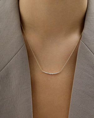 Exquisite Graduated Single Prong Diamond Necklace for Timeless Elegance.