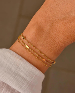 Elegant Waterproof Gold Stainless Steel Layered Bracelet - Dainty Stackable Design for Women.