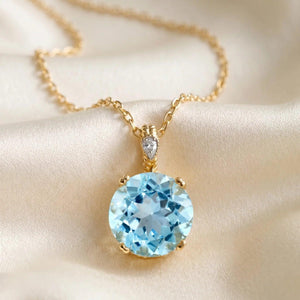 Stunning 14K Yellow Gold Sky Blue Topaz and Diamond Pendant.