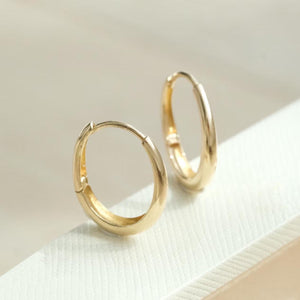 Dainty 14K Solid Gold Oval Hoop Earrings - Minimalist Skinny Huggie Hoops for Everyday Elegance.