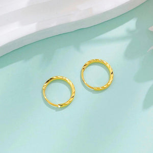 Luxurious 24K Gold Minimalist Wave Hoop Earrings for Elegant Women.