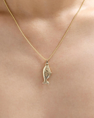 Exquisite Golden Catch Pendant - A Timeless Treasure.