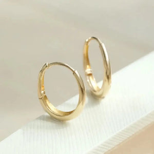 Dainty 14K Solid Gold Oval Hoop Earrings - Minimalist Skinny Huggie Hoops for Everyday Elegance.