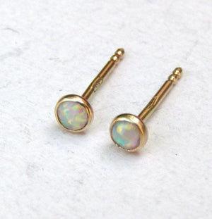 Dazzling 14K Yellow Gold Opal Stud Earrings - Adorable 3mm White Opal for Everyday Elegance and Special Occasions.
