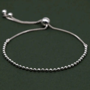 Elegant Sterling Silver Adjustable Minimalist Slider Bracelet with 2mm Beads for Women.