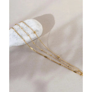 Elegant Waterproof Gold Stainless Steel Layered Bracelet - Dainty Stackable Design for Women.