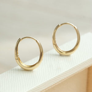 Dainty 14K Solid Gold Oval Hoop Earrings - Minimalist Skinny Huggie Hoops for Everyday Elegance.