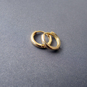 Stunning 14K Solid Gold Oval Hoop Earrings - Dainty Skinny Huggie Hoops for Elegant Women.