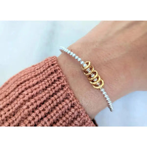 Sterling Silver Milestone Birthday Bracelet with Gold Decade Rings - A Custom Gift for Her.