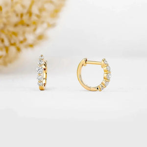 Stunning 14K Gold Diamond Graduated Huggie Hoop Earrings.