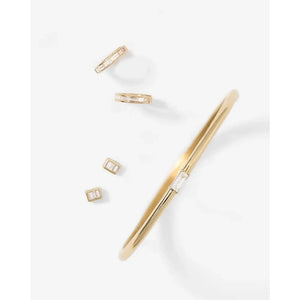 Stunning Baguette Channel-Set Huggie Earrings.