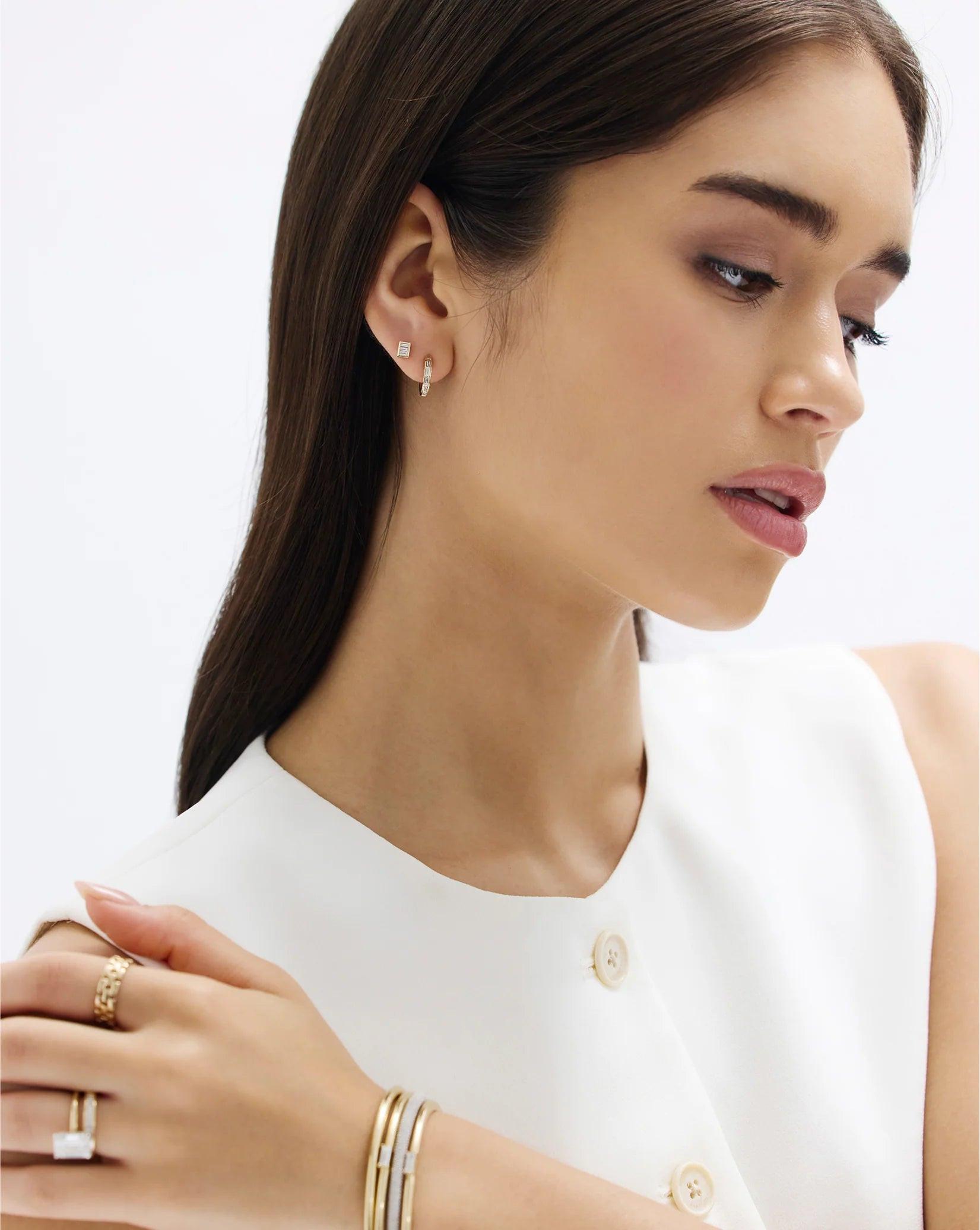Stunning Baguette Channel-Set Huggie Earrings.