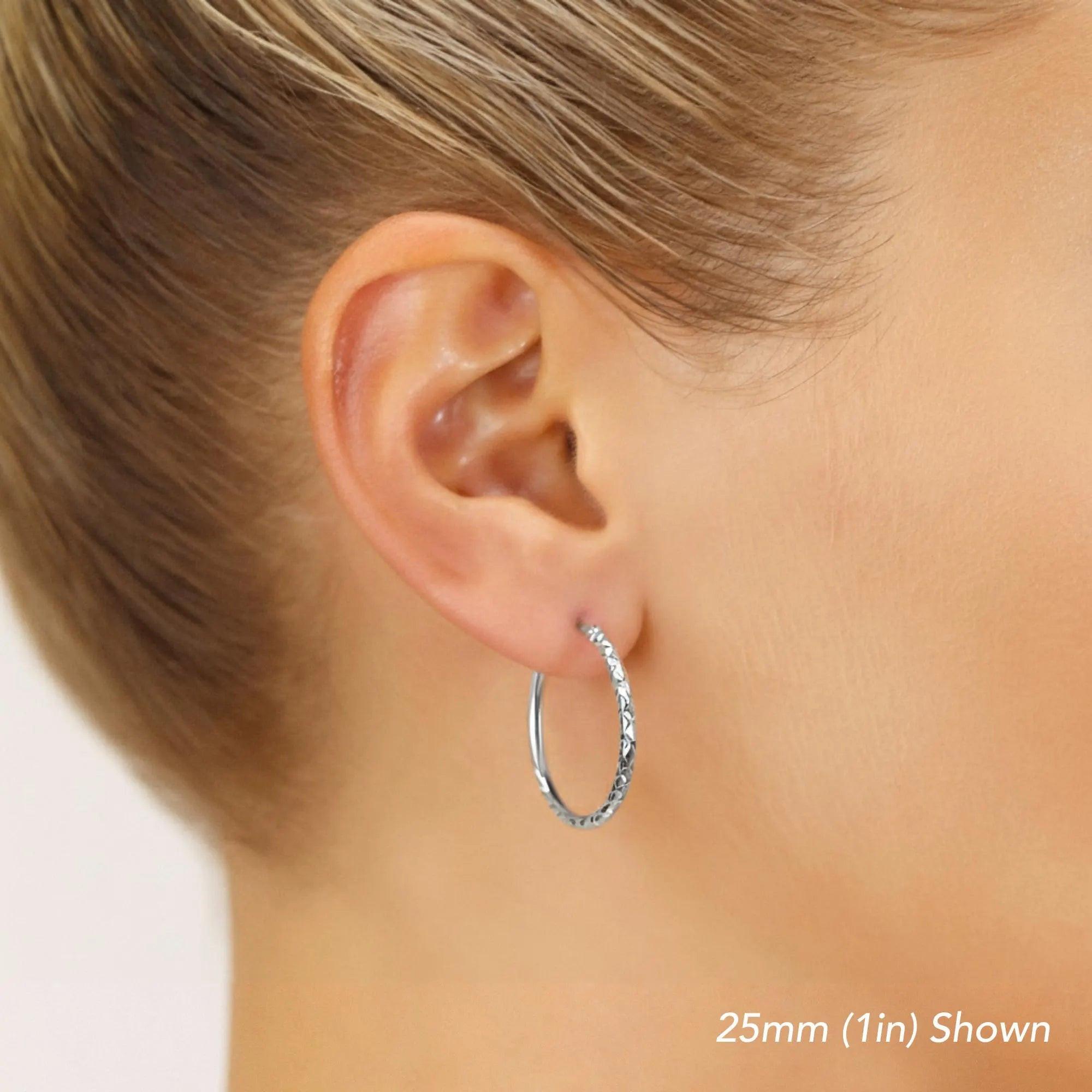 Stunning 14K White Gold Diamond-Cut Hoop Earrings - Elegant Hand-Engraved X-Pattern Available in Small, Medium, and Large Sizes.