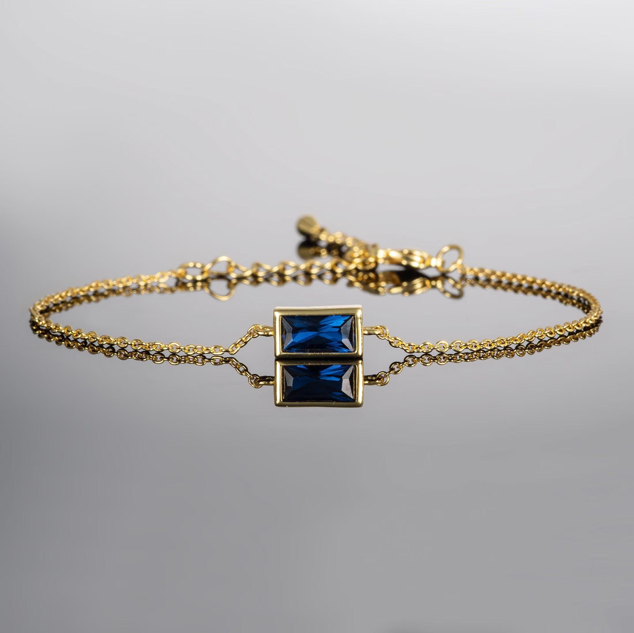 Elegant Adjustable Gold Plated Dainty Bracelet with Blue Stone for Women.