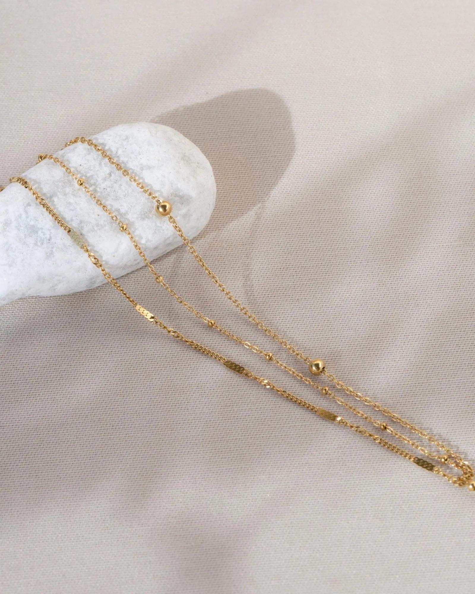 Elegant Waterproof Gold Stainless Steel Layered Bracelet - Dainty Stackable Design for Women.
