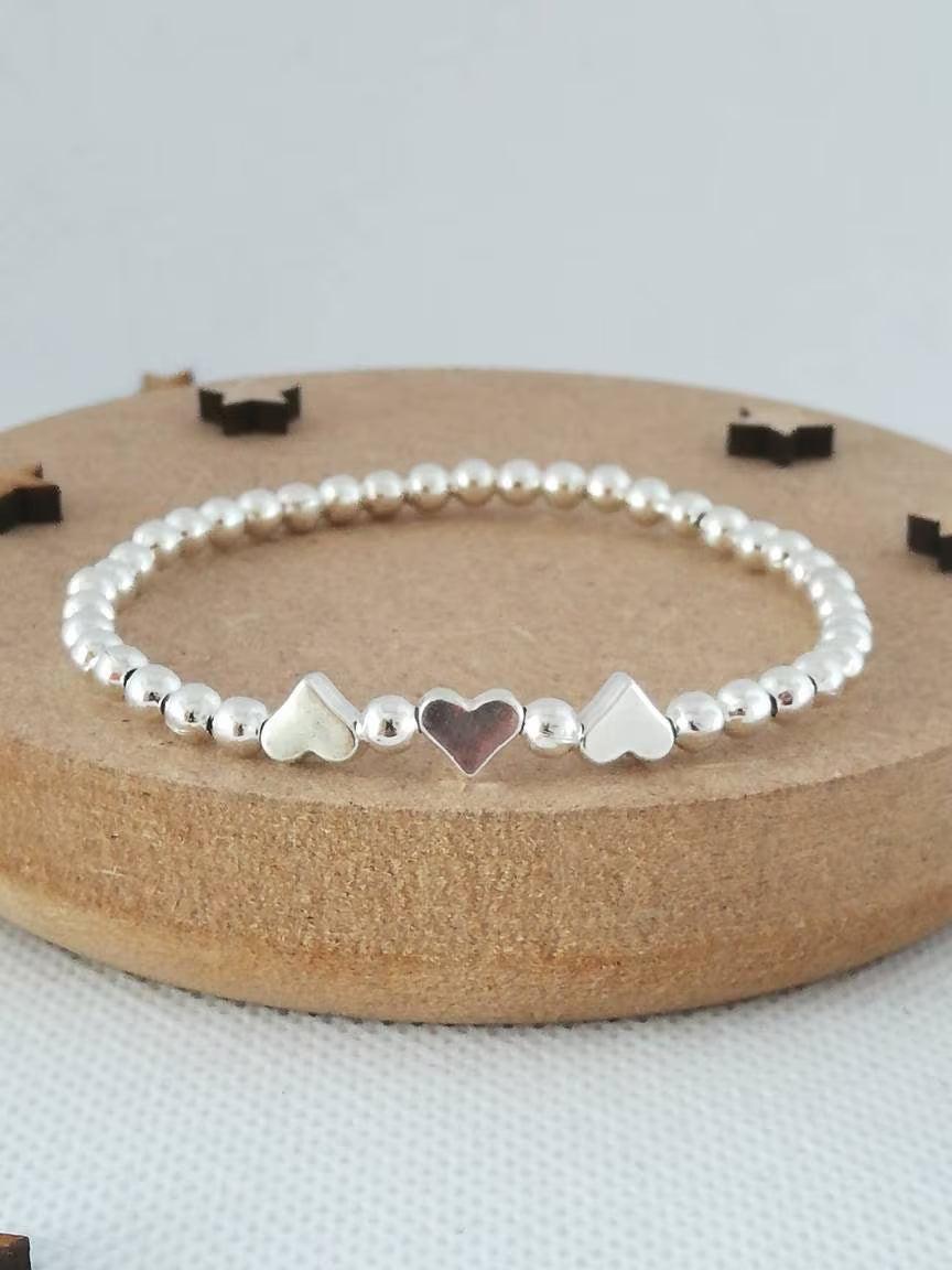 Charming Silver Heart Stretch Bracelet - Perfect Beaded Stacking Gift for Girlfriend or Teacher.