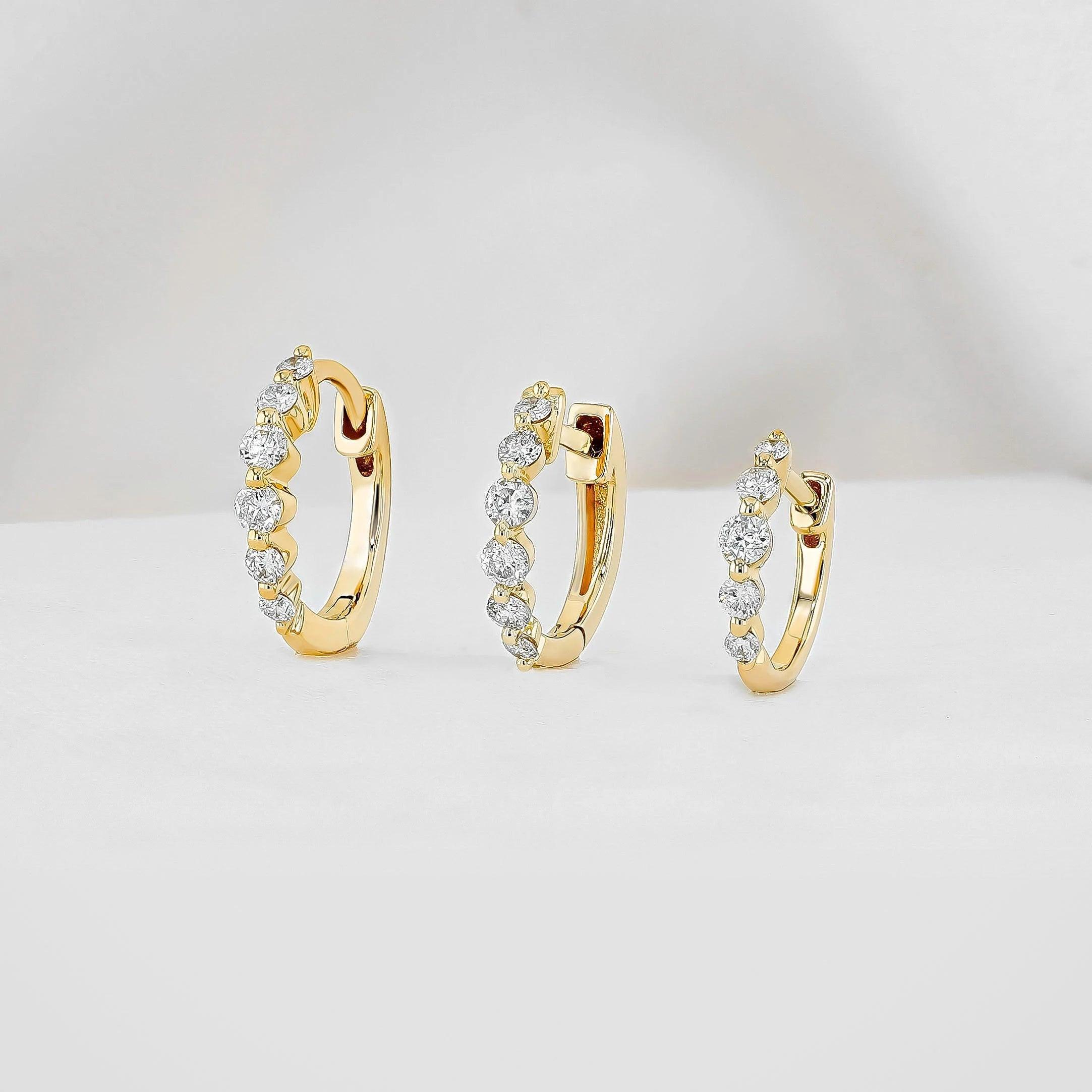 Stunning 14K Gold Diamond Graduated Huggie Hoop Earrings.