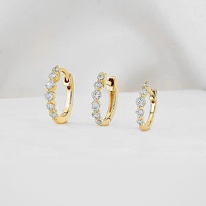 Stunning 14K Gold Diamond Graduated Huggie Hoop Earrings.