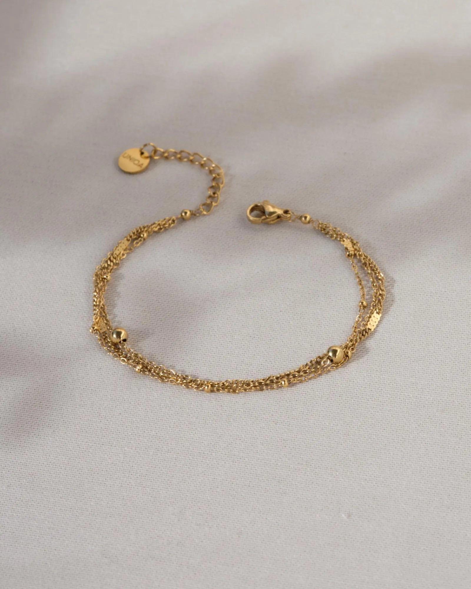 Elegant Waterproof Gold Stainless Steel Layered Bracelet - Dainty Stackable Design for Women.