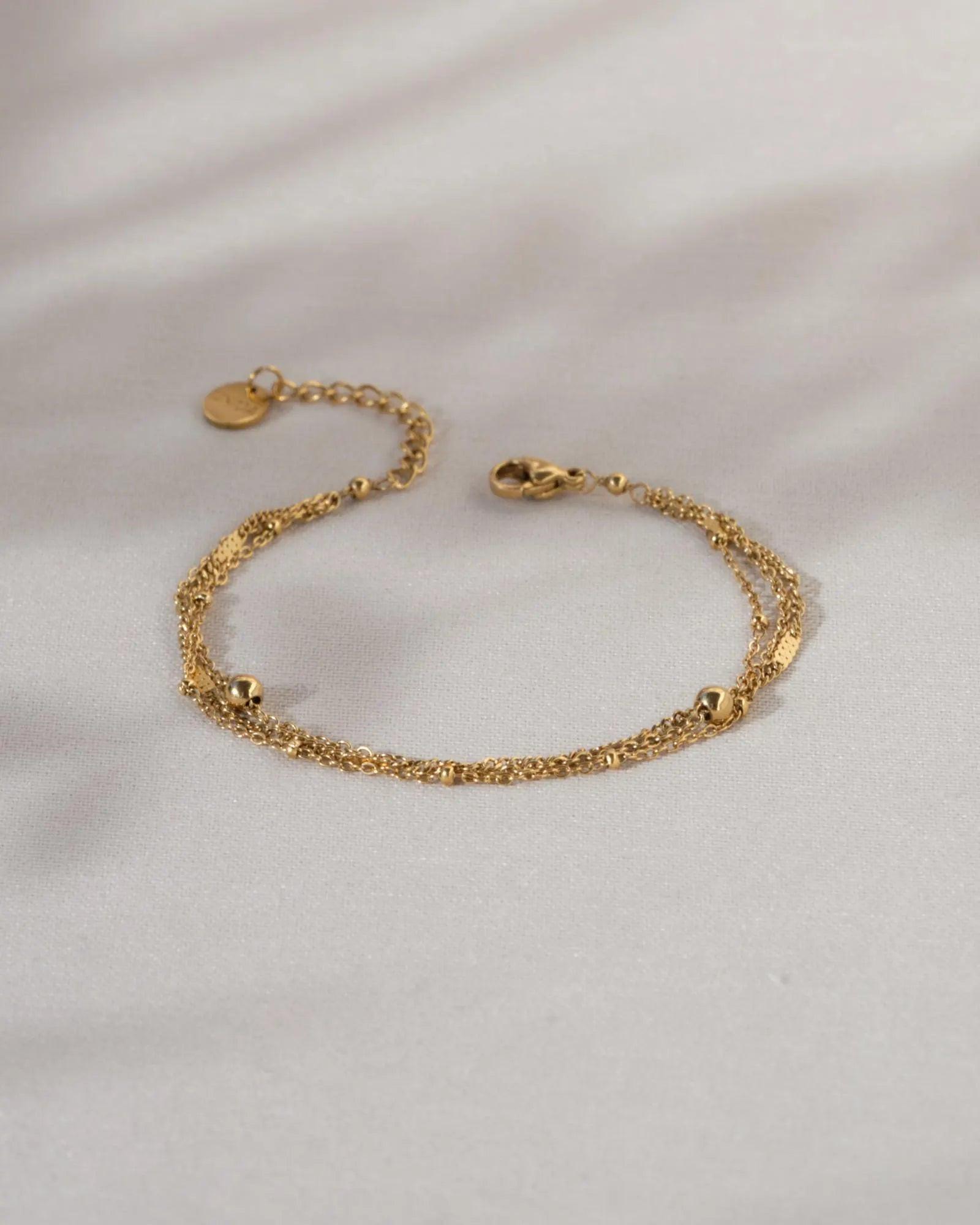 Elegant Waterproof Gold Stainless Steel Layered Bracelet - Dainty Stackable Design for Women.