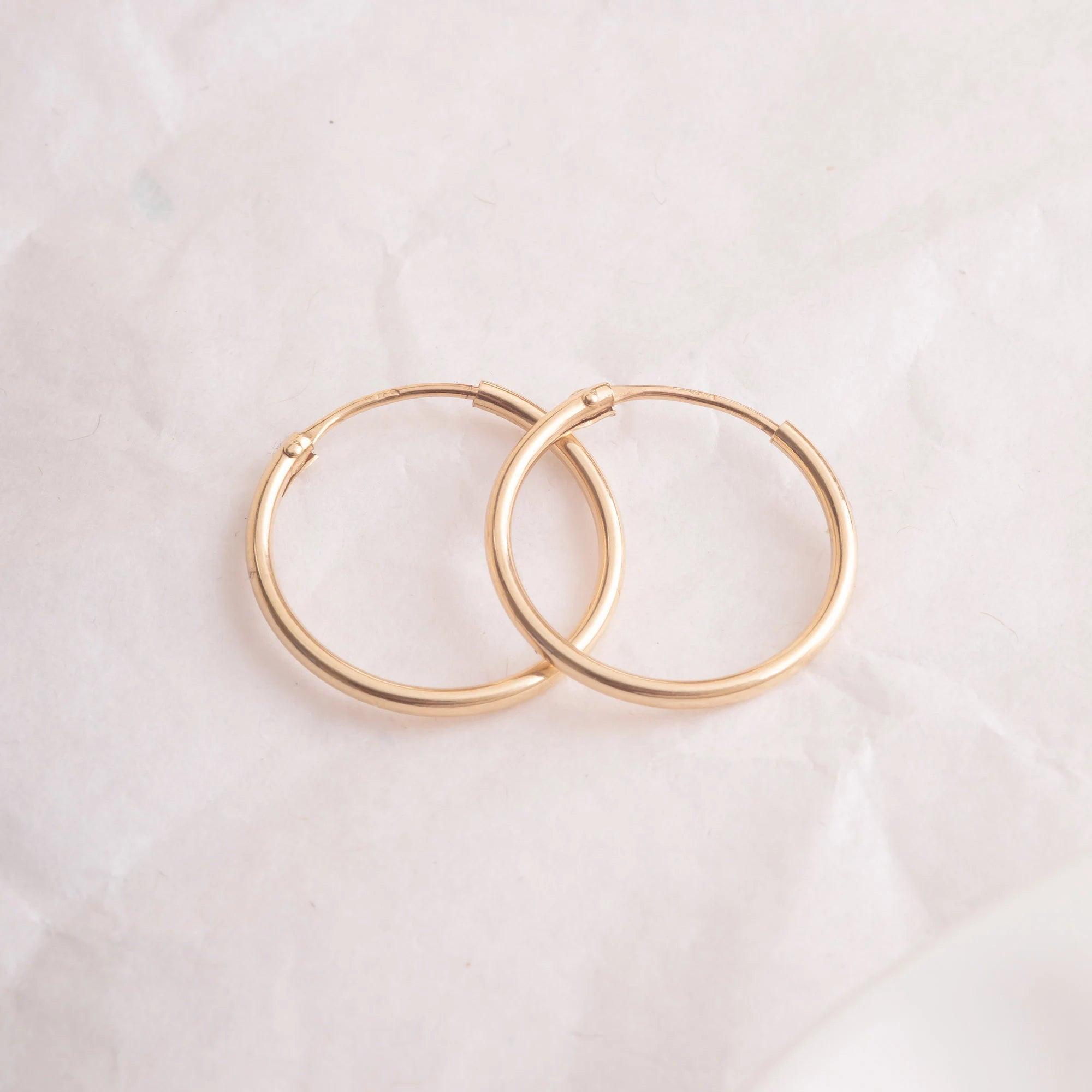 Elegant 14K Gold Hoop Earrings - Dainty Thin Wire Hoops in Small, Medium, and Large for Everyday Wear.