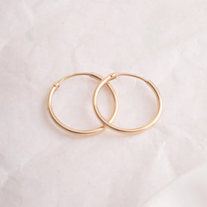 Elegant 14K Gold Hoop Earrings - Dainty Thin Wire Hoops in Small, Medium, and Large for Everyday Wear.