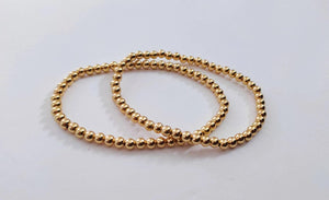 Elegant Gold Rose Silver Beaded Stacking Bracelets - 14K Gold Plated Elastic Design.