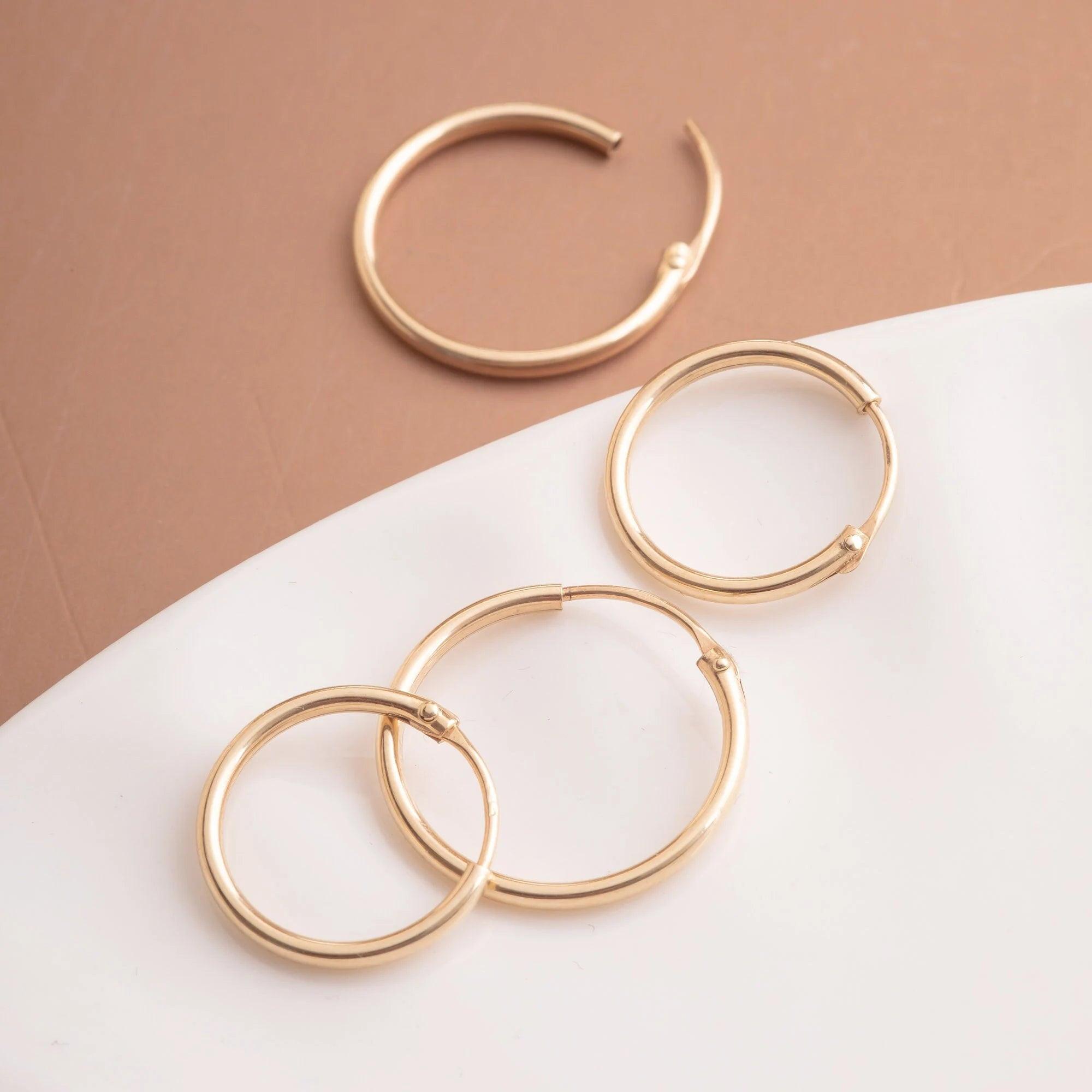 Elegant 14K Gold Hoop Earrings - Dainty Thin Wire Hoops in Small, Medium, and Large for Everyday Wear.