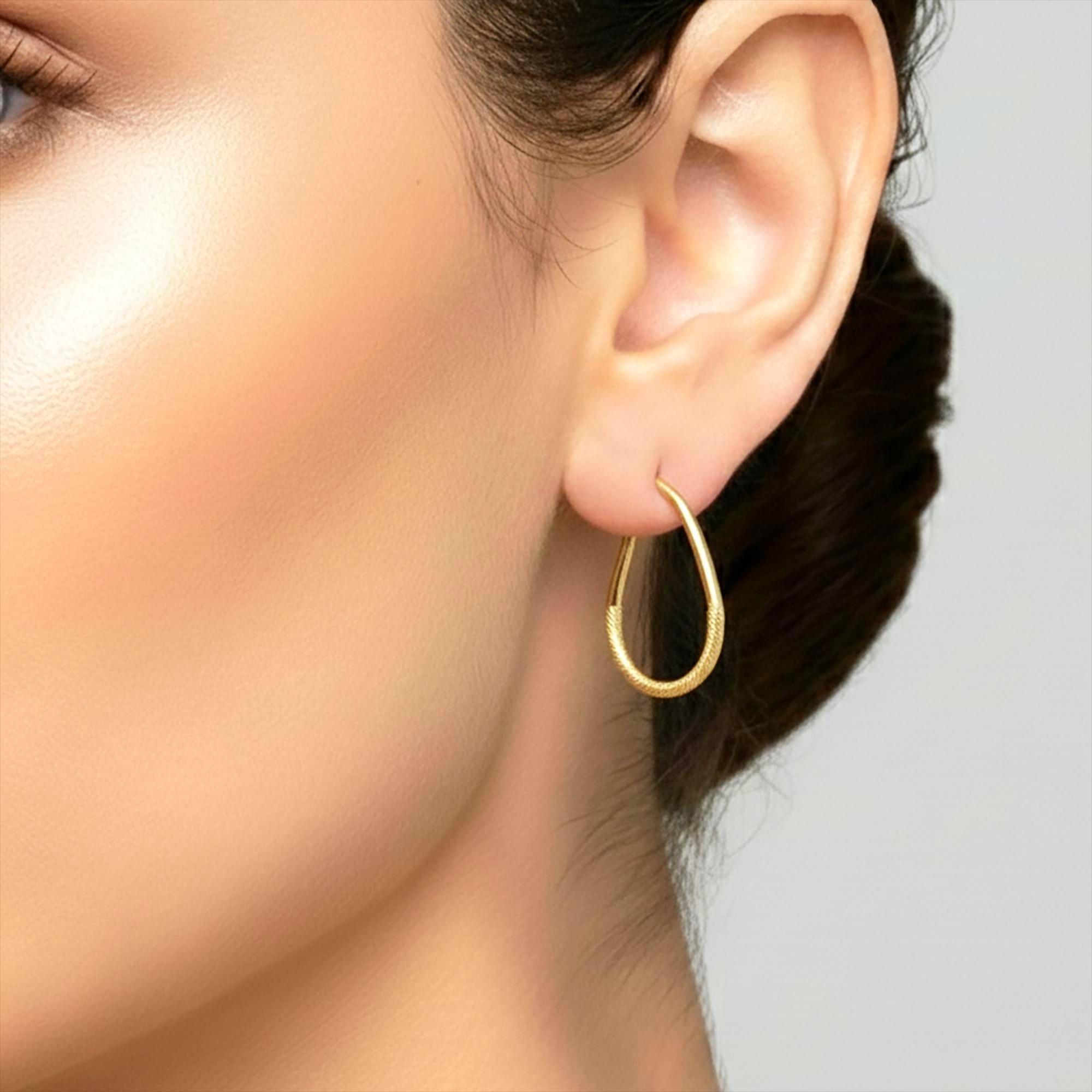 Elegant 10K Yellow Gold Textured Oval Hoop Earrings - Timeless Everyday Style.