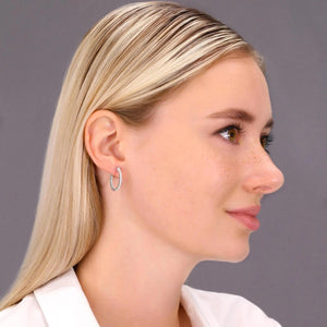 14K White Gold Diamond Half Eternity Huggie Hoop Earrings - 0.57 Carat Total Weight.