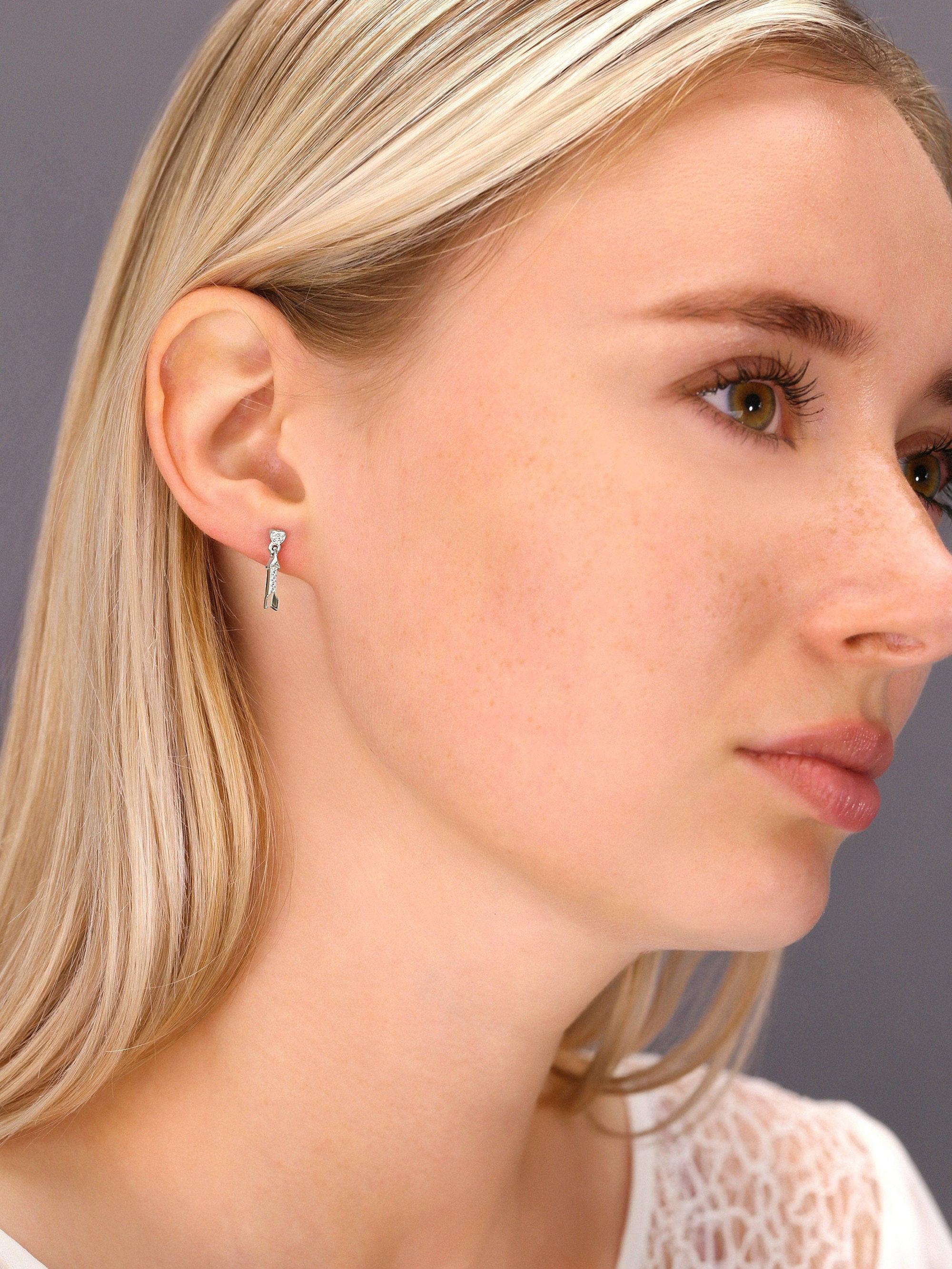 Sterling Silver CZ Cupid's Arrow Dangle Earrings - Elegant & Dazzling.