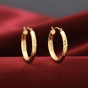Stunning 14K Yellow Gold Diamond-Cut Hand Engraved "X-Pattern" Round Hoop Earrings - Available in Small, Medium, and Large by TILO Jewelry.