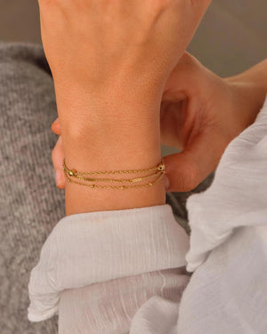 Elegant Waterproof Gold Stainless Steel Layered Bracelet - Dainty Stackable Design for Women.