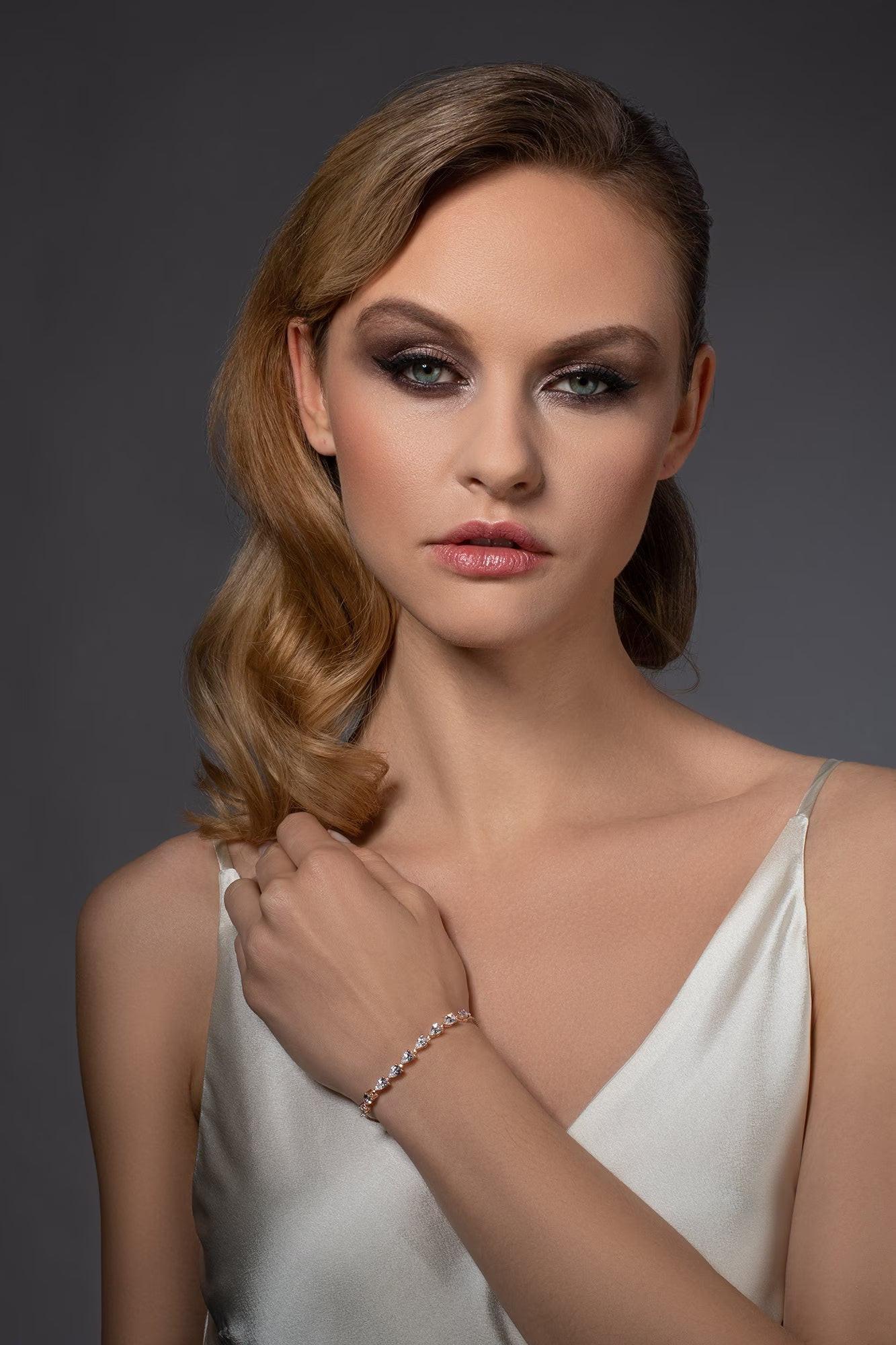 Elegant Gold Slider Bracelet with Dainty Pear-Shaped Cubic Zirconia for Women and Girls.