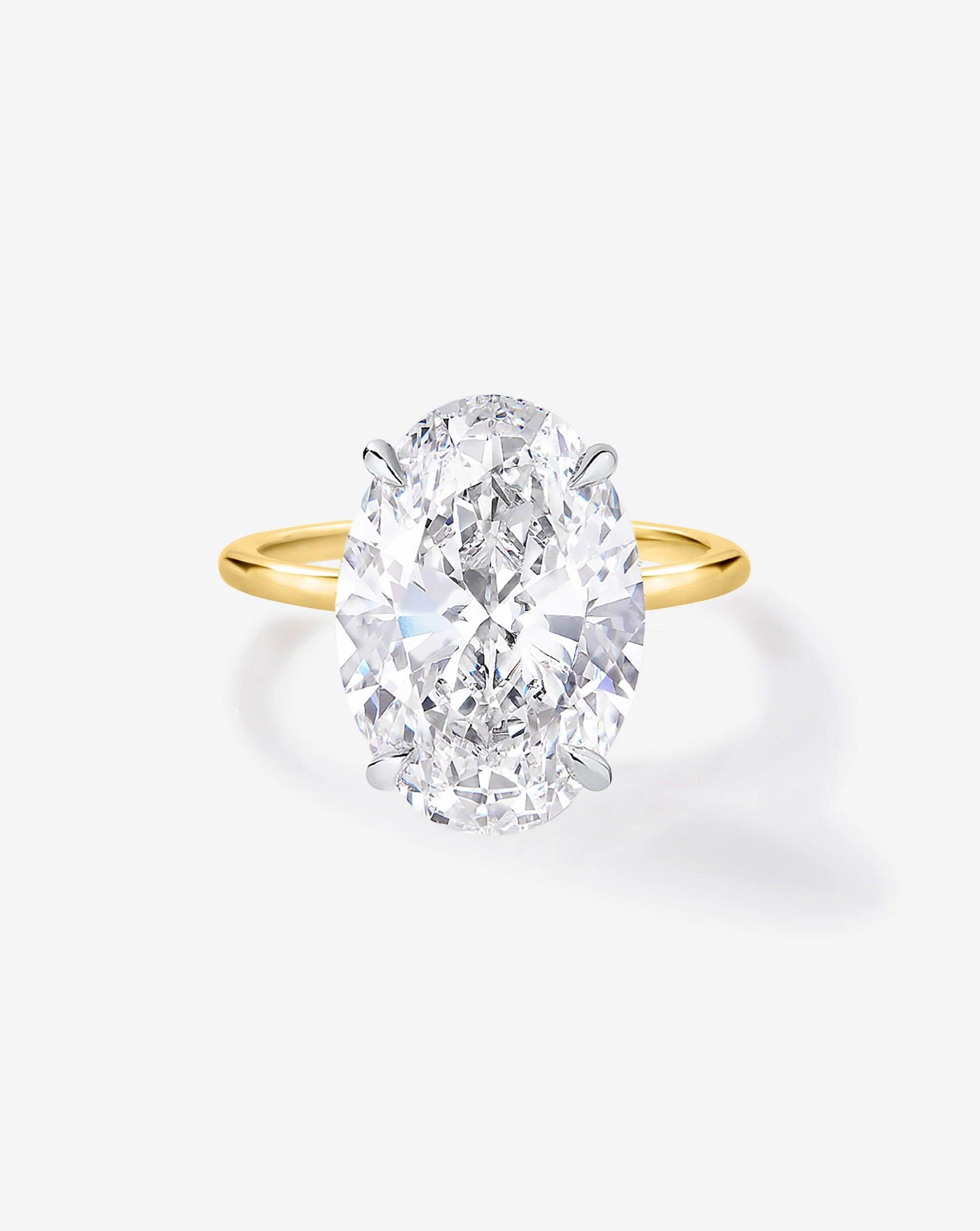 Exquisite 4.52 Carat Oval Lab Diamond with Whisper Thin® Hidden Halo Setting.