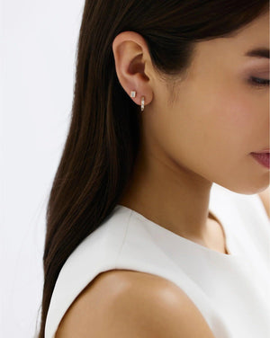 Stunning Baguette Channel-Set Huggie Earrings.