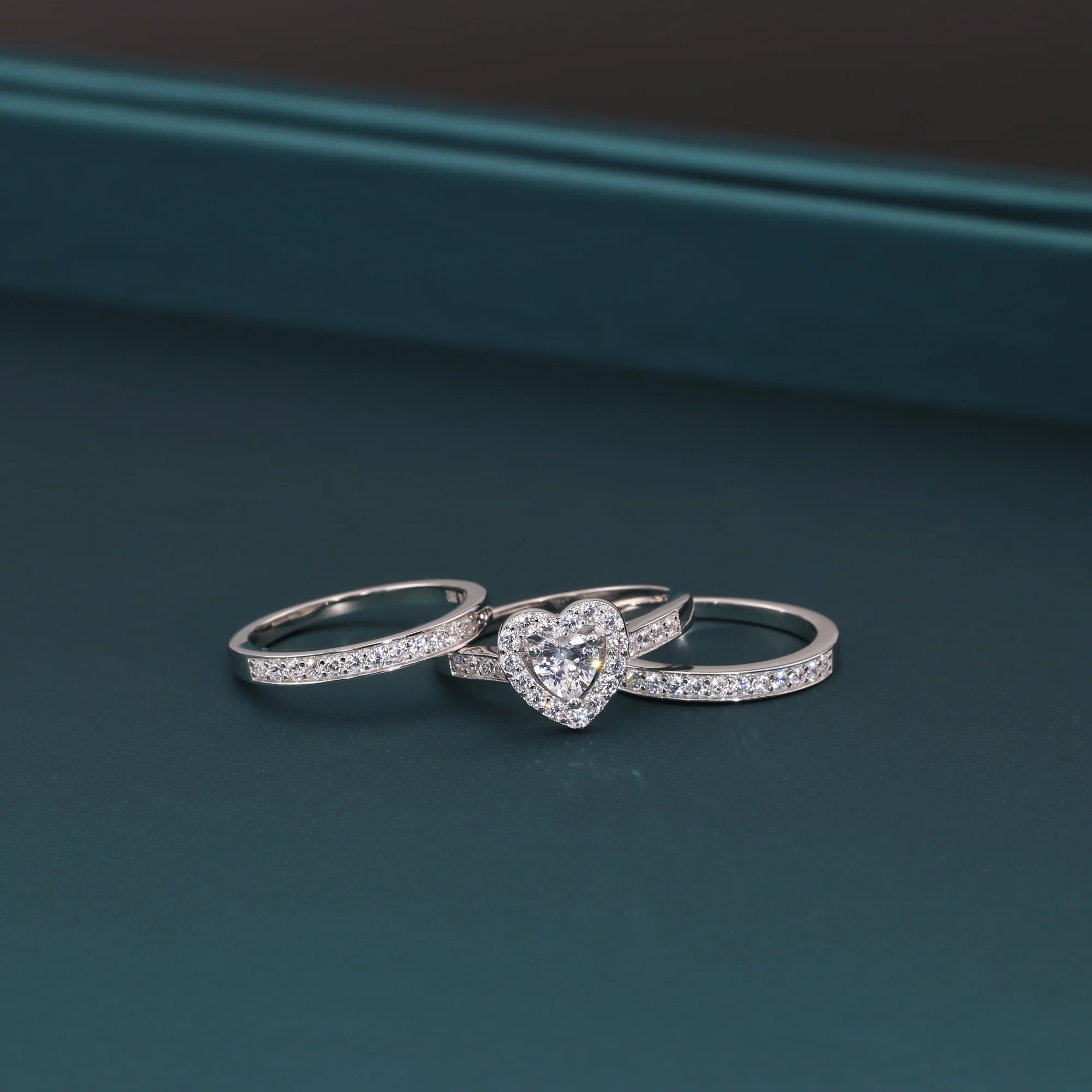 Radiant CZ Heart Three-Tier Engagement Ring Set in Sterling Silver - Perfect Bridal Ring Set for Proposals, Weddings, and Anniversaries.