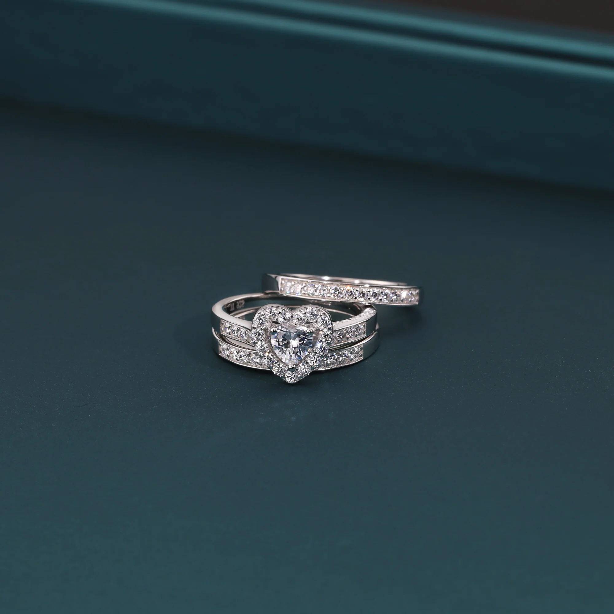 Radiant CZ Heart Three-Tier Engagement Ring Set in Sterling Silver - Perfect Bridal Ring Set for Proposals, Weddings, and Anniversaries.