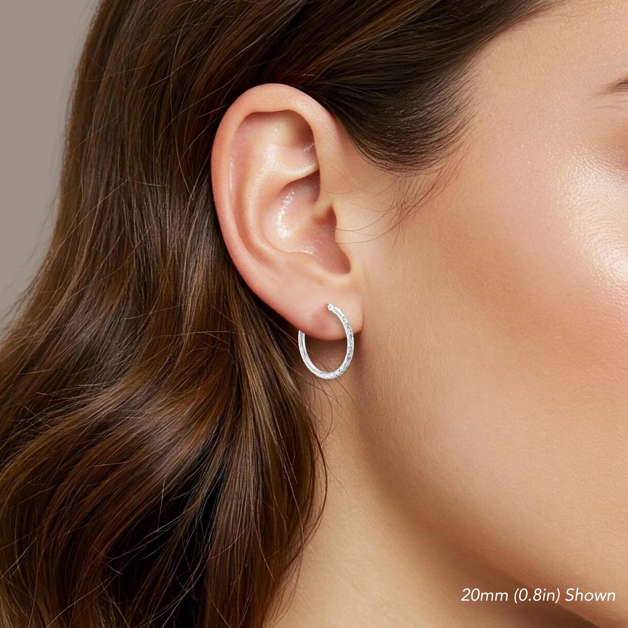 Stunning 14K White Gold Diamond-Cut Hoop Earrings - Elegant Hand-Engraved X-Pattern Available in Small, Medium, and Large Sizes.