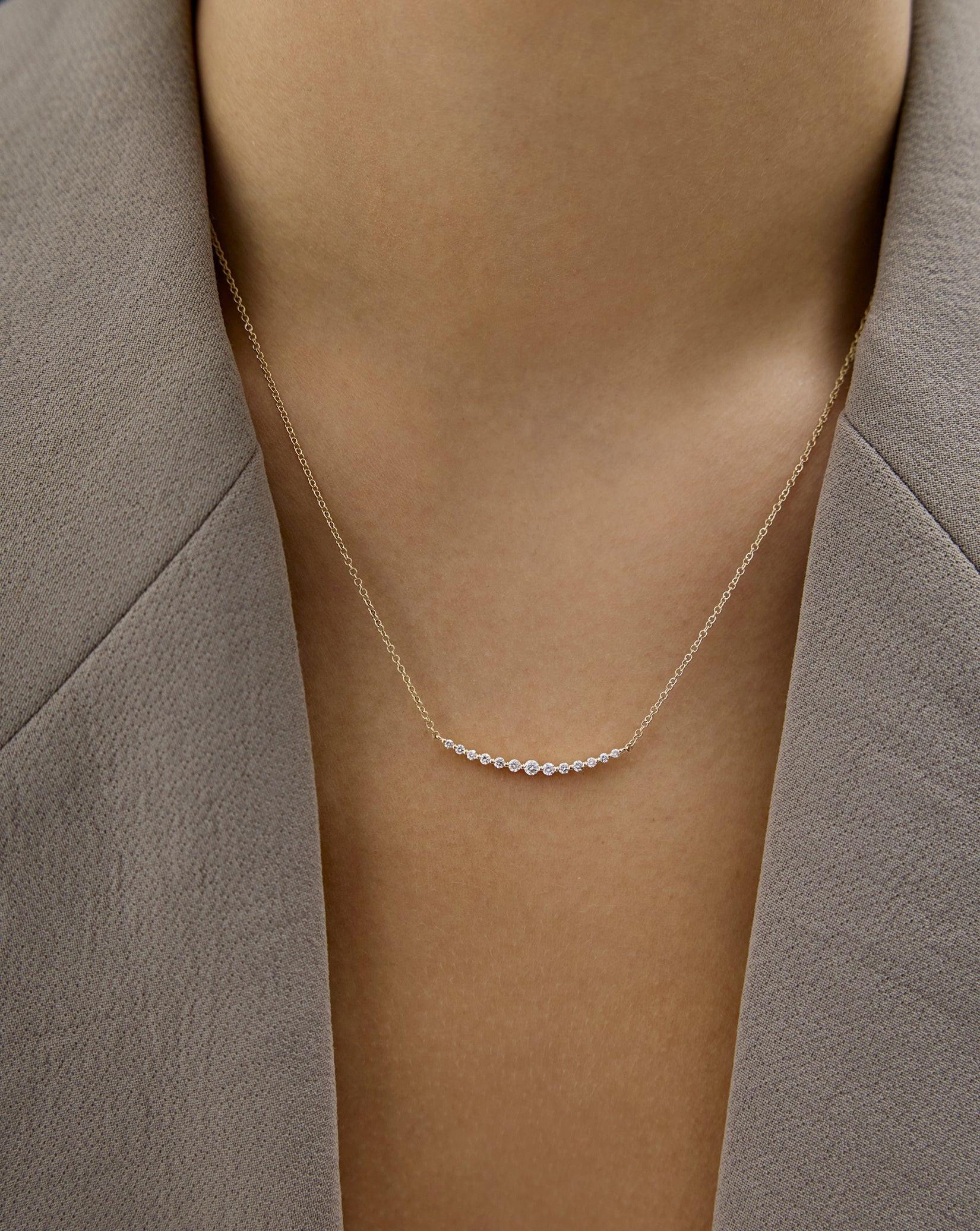 Exquisite Graduated Single Prong Diamond Necklace for Timeless Elegance.