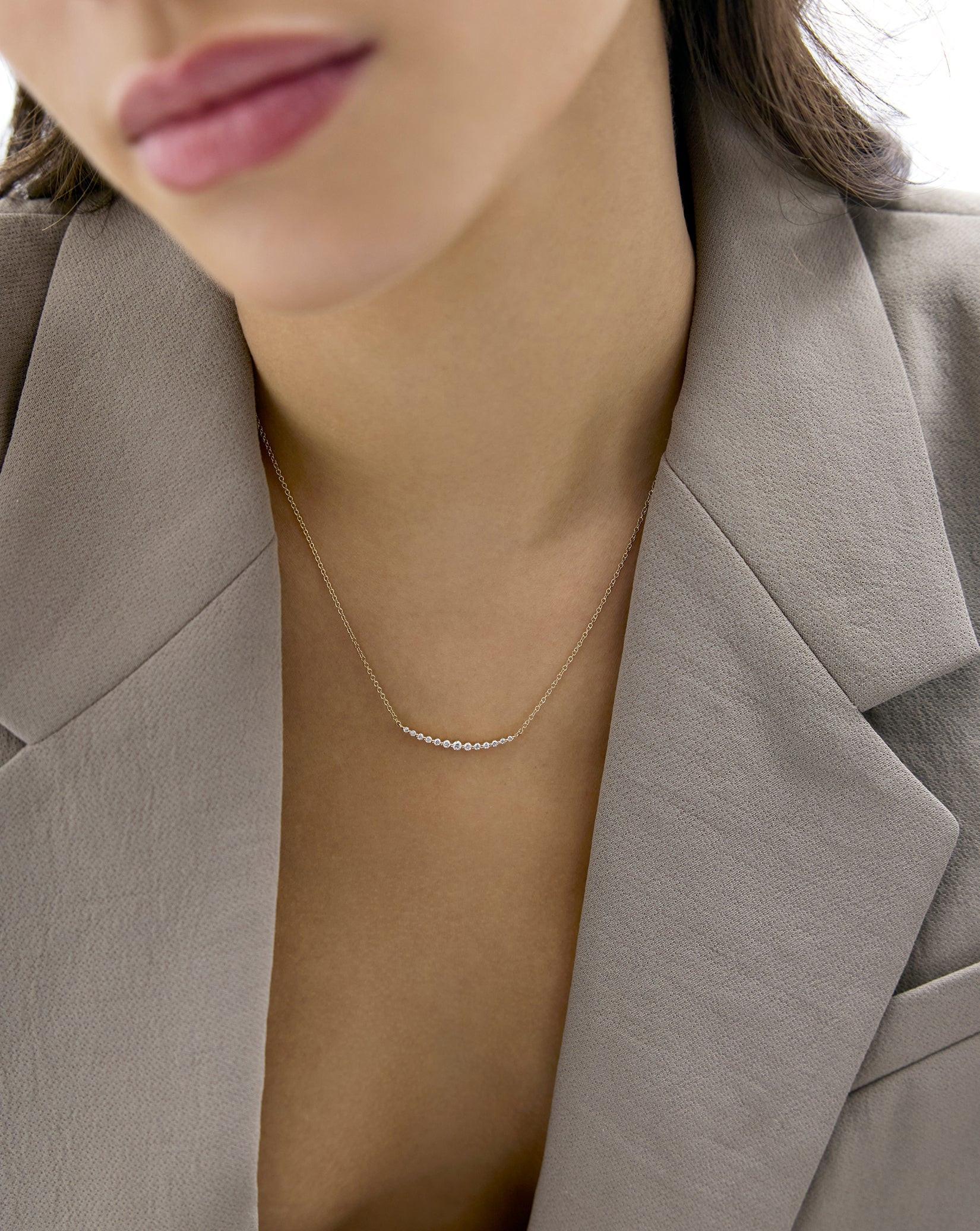 Exquisite Graduated Single Prong Diamond Necklace for Timeless Elegance.