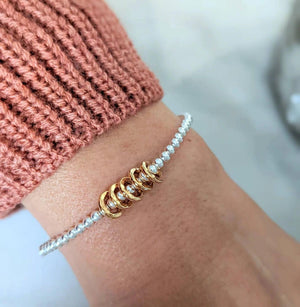 Sterling Silver Milestone Birthday Bracelet with Gold Decade Rings - A Custom Gift for Her.