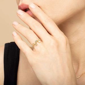 Elegant Gold Ribbon Ring - A Timeless Accessory.